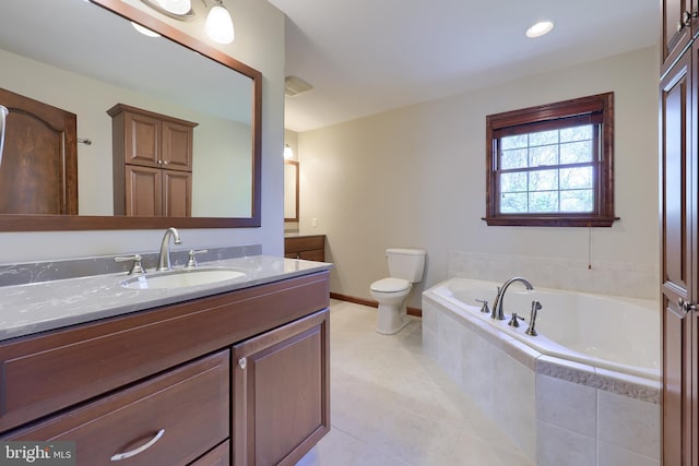 full bathroom with toilet, vanity, tile patterned flooring, baseboards, and a bath