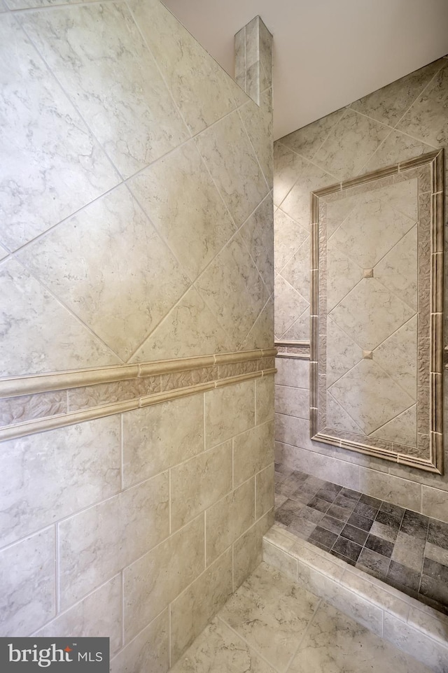 bathroom with tiled shower