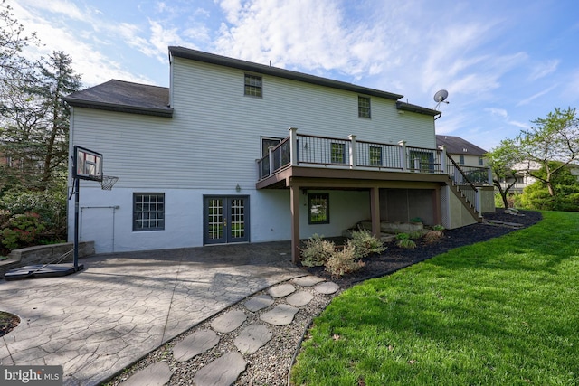 back of property featuring a patio, french doors, a wooden deck, stairway, and a yard