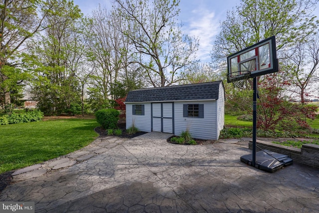 view of patio with a storage unit and an outbuilding