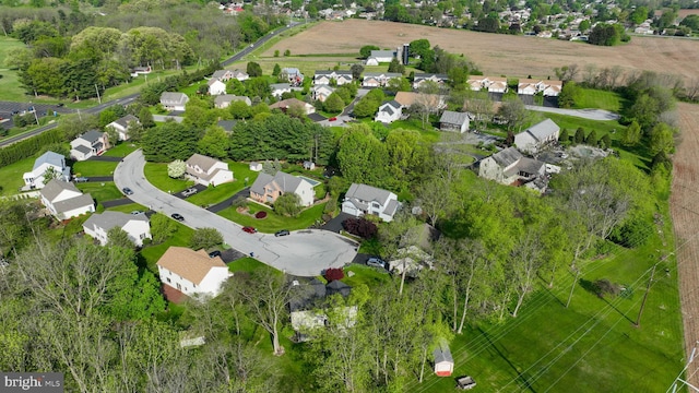 birds eye view of property with a residential view