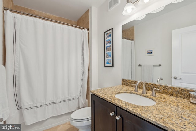 full bathroom featuring vanity, shower / tub combo with curtain, and toilet