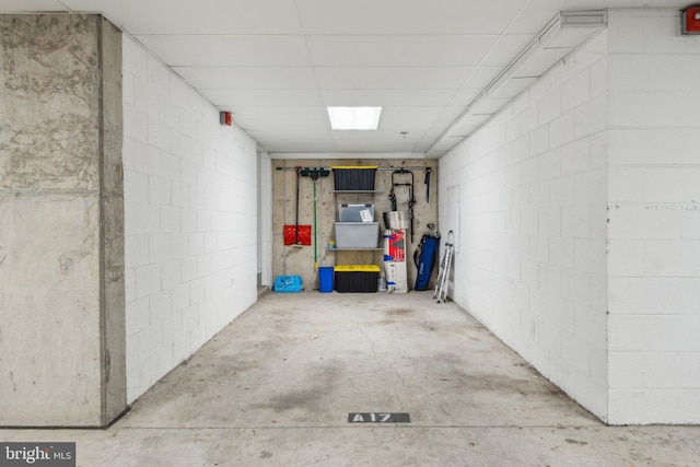 basement featuring a drop ceiling