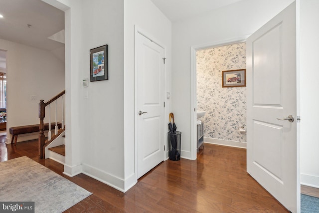 hallway featuring dark hardwood / wood-style flooring