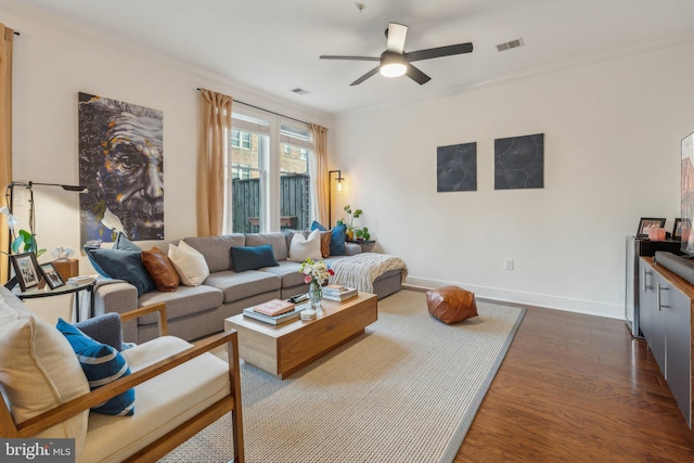 living room with crown molding, ceiling fan, and dark hardwood / wood-style floors