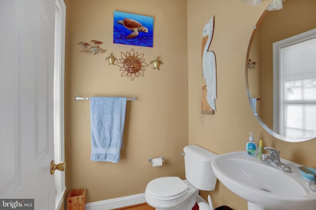 bathroom featuring sink and toilet