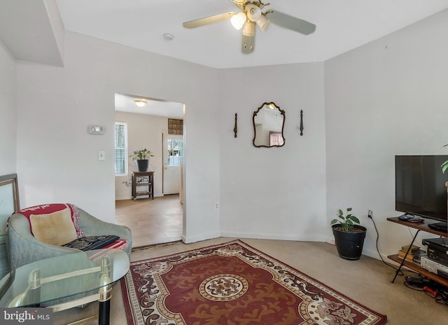 living room featuring ceiling fan