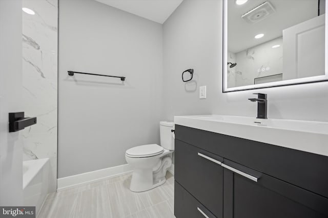 full bathroom with vanity, toilet, and tiled shower / bath combo