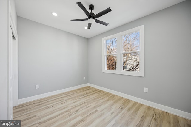 unfurnished room featuring ceiling fan and light hardwood / wood-style flooring