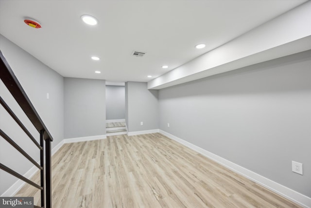 basement featuring light hardwood / wood-style floors