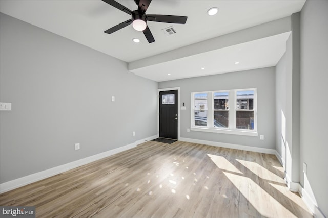 entryway with light hardwood / wood-style flooring and ceiling fan