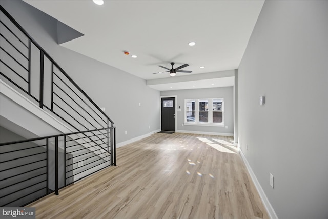 foyer entrance featuring ceiling fan and light hardwood / wood-style flooring