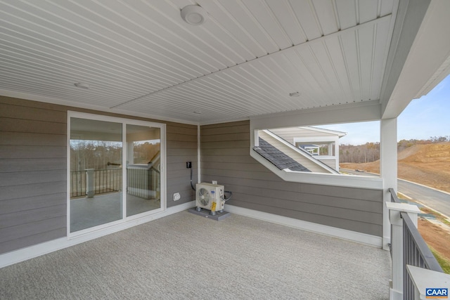 view of patio featuring a balcony and ac unit