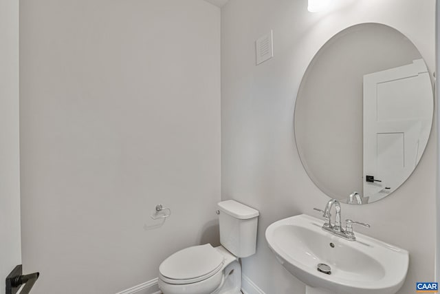 bathroom with sink and toilet