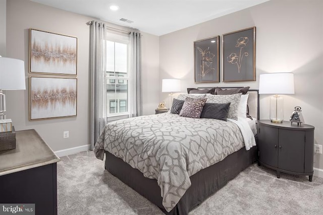 bedroom featuring light colored carpet