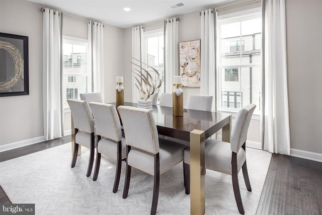 dining area featuring dark wood-type flooring