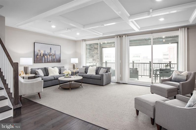 living room featuring beamed ceiling, wood-type flooring, and coffered ceiling