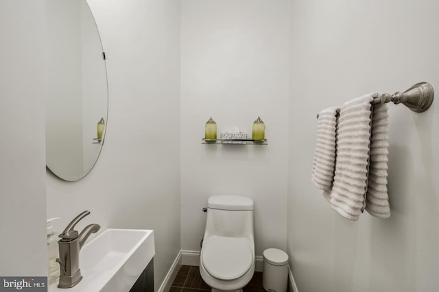 bathroom with tile patterned floors, toilet, and sink