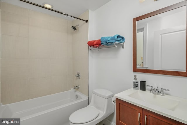 full bathroom featuring vanity, bathtub / shower combination, and toilet