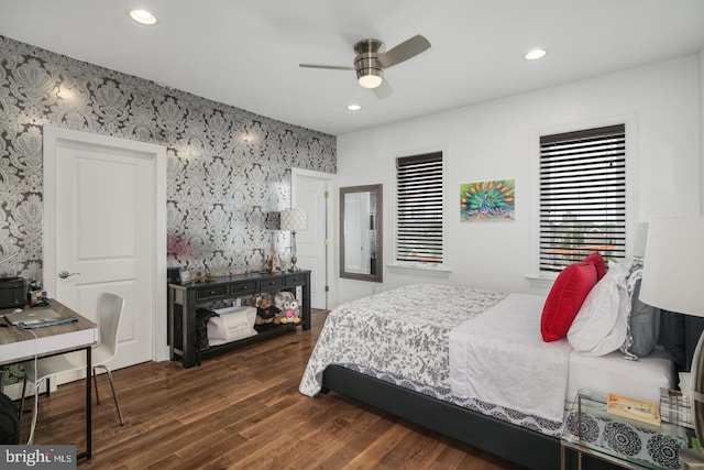 bedroom with dark wood-type flooring and ceiling fan