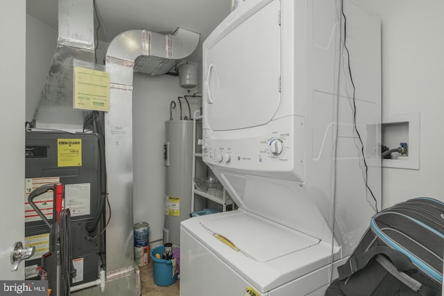 laundry area with water heater and stacked washer and clothes dryer