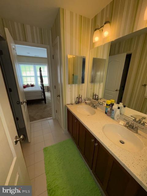 bathroom featuring tile patterned flooring and vanity