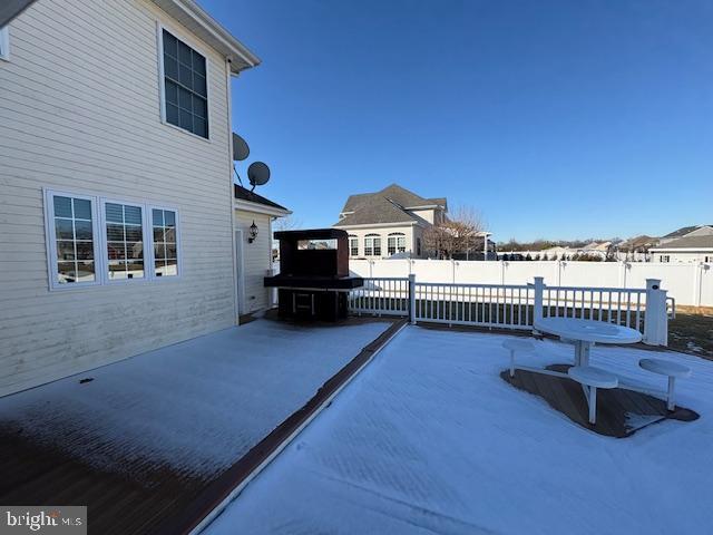 view of snow covered patio