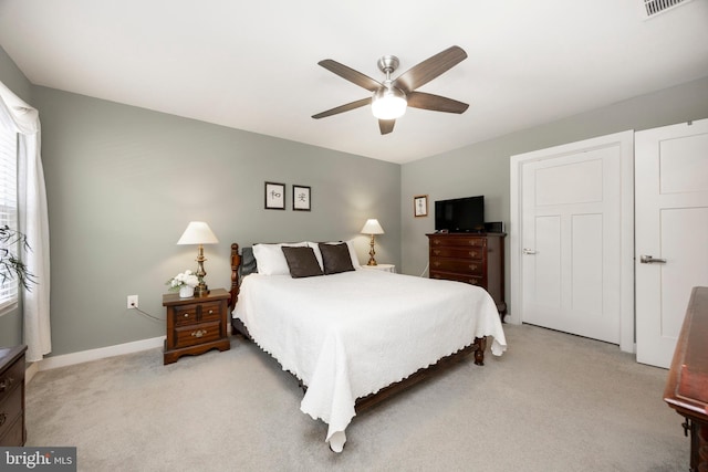 carpeted bedroom with ceiling fan