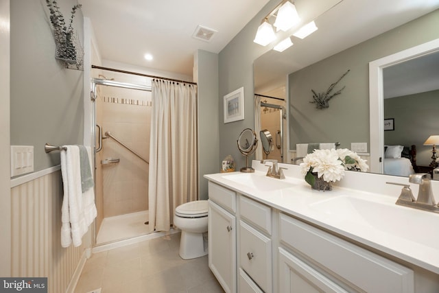 bathroom featuring tile patterned flooring, toilet, vanity, and a shower with shower curtain