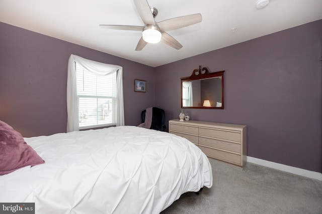 bedroom featuring ceiling fan and light carpet