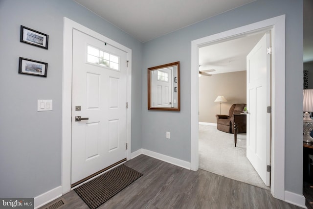 entrance foyer with dark hardwood / wood-style floors