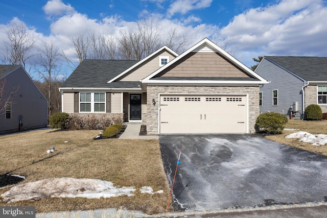 view of front facade with a garage and a front yard