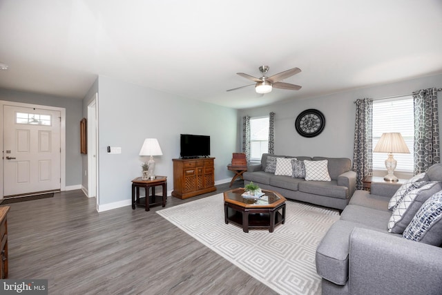 living room with hardwood / wood-style flooring and ceiling fan