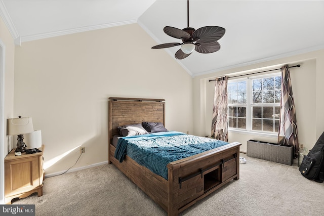 carpeted bedroom featuring crown molding, vaulted ceiling, and ceiling fan