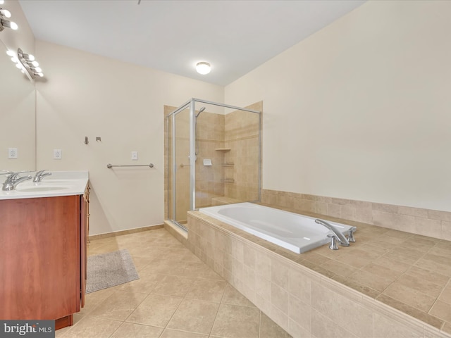 bathroom with tile patterned flooring, vanity, and plus walk in shower