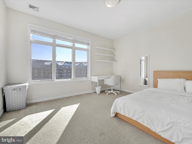 bedroom with light colored carpet