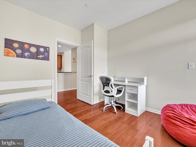 bedroom with wood-type flooring