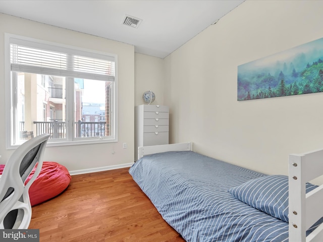 bedroom with hardwood / wood-style floors