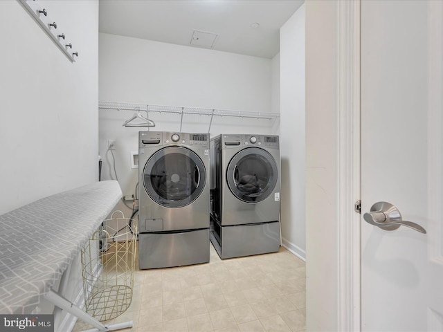 washroom with washer and clothes dryer