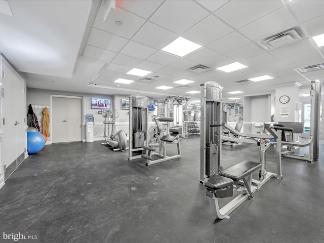 gym featuring a drop ceiling