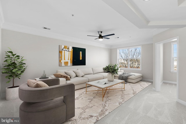 carpeted living room featuring crown molding and ceiling fan