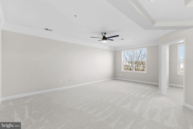 unfurnished room featuring ornamental molding, light colored carpet, and ceiling fan