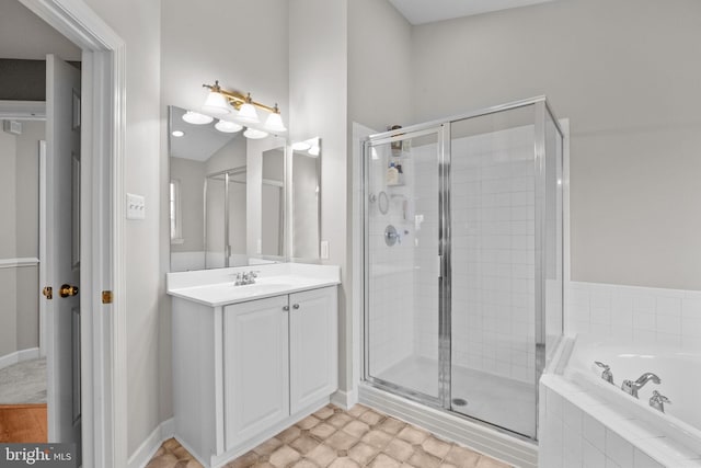 bathroom featuring vanity and separate shower and tub