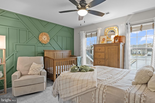 carpeted bedroom featuring ceiling fan