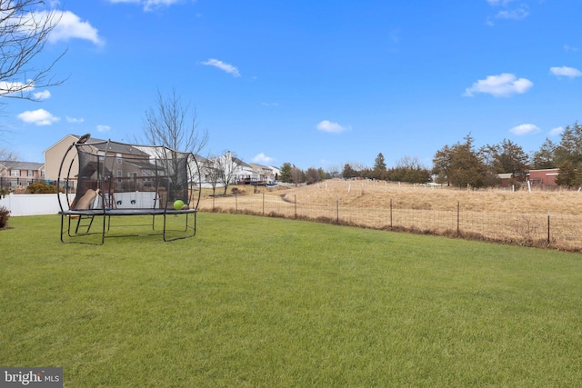 view of yard featuring a trampoline