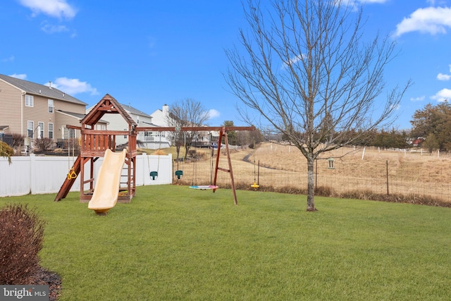 view of jungle gym with a lawn