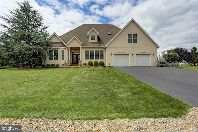 view of front of home with a garage and a front yard