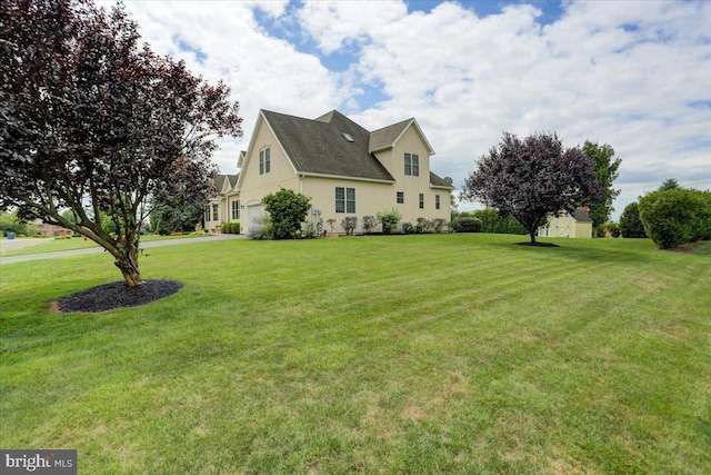 view of property exterior featuring a lawn