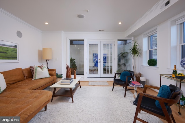 living room with french doors and ornamental molding