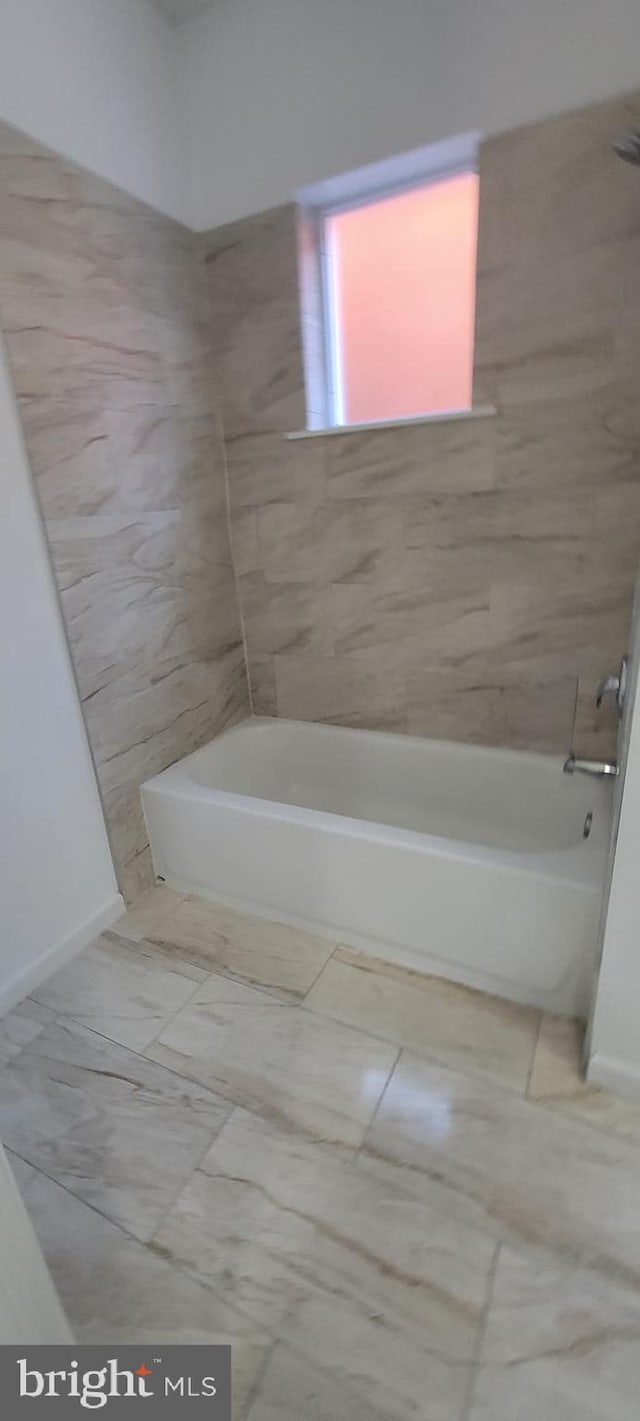 bathroom with bathtub / shower combination